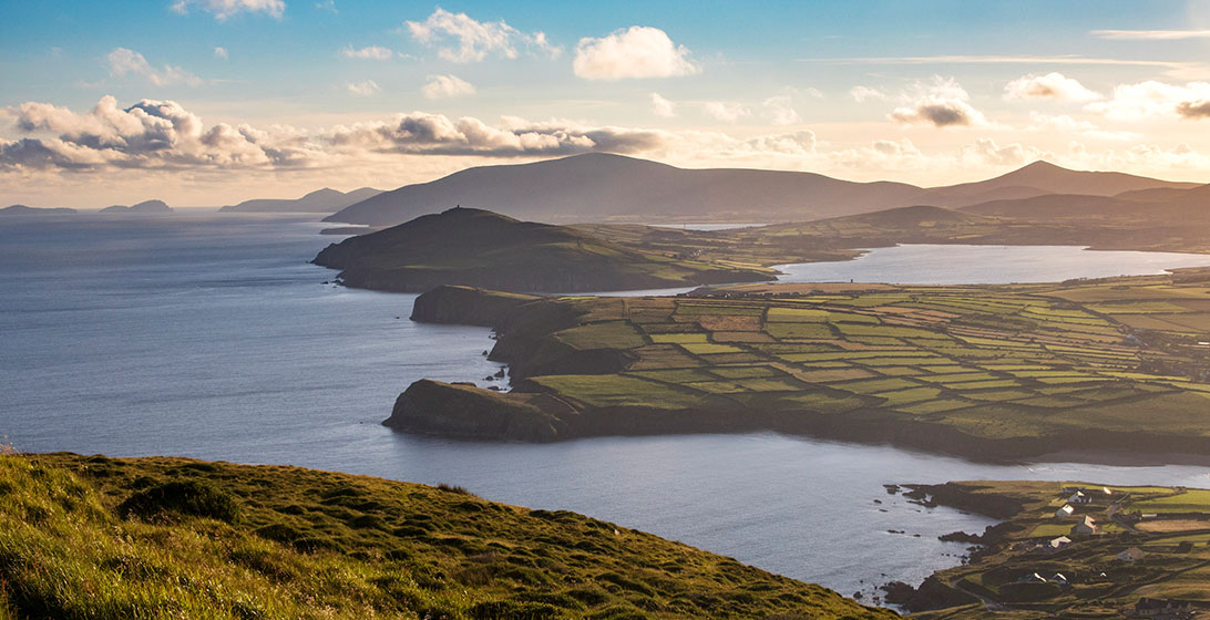Aerial photograph of Irish fields and mountains on the coast