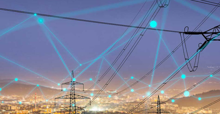 Image of pylons superimposed onto a blurred background of a city. There are lines and dots laid over the top of the image