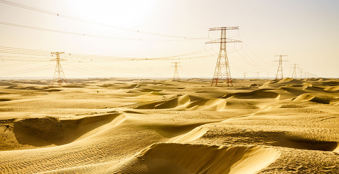Photograph of electricity pylons in the desert