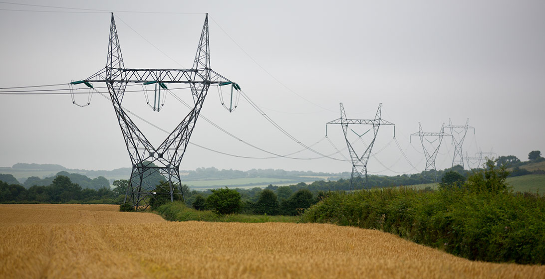 Photograph of electricity pylons in fields